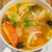 8 Tom Yum · Lemongrass soup with onion, mushroom, tomato, cilantro.