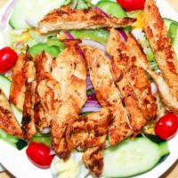 Cobb Salad · Romaine and iceberg lettuce, tomatoes, cucumbers, onions, green peppers, grilled chicken, ha...