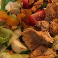 Grilled Chicken Salad · Romaine and iceberg lettuce, tomatoes, cucumbers, hard-boiled egg, breast of chicken, mozzar...