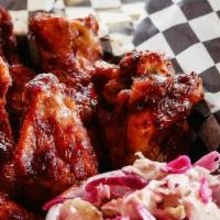 Wings · Gluten sensitive. Choice of house barbecue sauce, hot sauce or Jamaican jerk sauce, blue che...