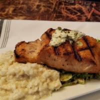 Grilled Salmon · Cauliflower risotto, shaved brussels sprouts, lemon butter sauce.