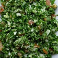 Tabouleh Salad · Finely chopped parsley, tomatoes and onions, mixed with mint, cracked wheat and dressed with...