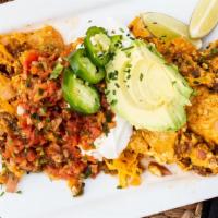 Migas · Chorizo, red onions, green chilies, crispy corn tortillas and pepperjack cheese, scrambled w...