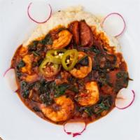 Low Country Shrimp & Grits · Spicy shrimp, andouille, bell pepper, onion, spinach, garlicky tomato broth, grits.
