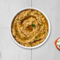 All Hope Is Baba Ghanoush · Mashed grilled eggplant mixed with tahini, lemon, garlic, special seasoning and tahini sauce.