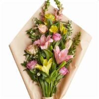 Designers Choice Spring Wrapped Arrangement · Let our designers create you a one of a kind, beautiful spring mix arrangement wrapped in yo...