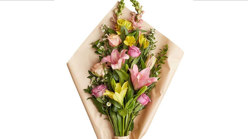 Designers Choice Spring Wrapped Arrangement · Let our designers create you a one of a kind, beautiful spring mix arrangement wrapped in your choice of parchment paper or cellophane. You cannot go wrong with this rustically artistic bouquet.  No better way to show someone special that you care!

Some flowers and containers may have to be substituted depending on seasonal demand and availability.  We will do our best to insure you love the final product.