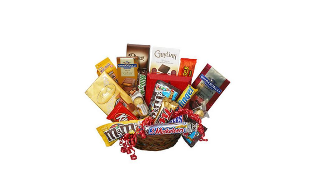 Chocolate Lovers' Basket Gift Basket (Shown As Deluxe) · This is a candy lover's dream! Full to the brim with sugar, spice, and everything nice, the Chocolate Lovers' Basket is the perfect gift for that special someone in your life. Surprise them with something as sweet as they are and send them their candy dreams today! Some flowers and containers may have to be substituted depending on seasonal demand and availability.  We will do our best to insure you love the final product.