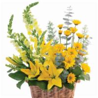 Cheerful Yellow Basket Arrangement (Shown As Deluxe) · This beautiful basket is full of joy! Featuring gorgeous yellow snapdragons, lilies, daisy p...