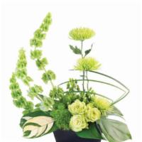 Lovely Lime Floral Arrangement (Shown As Deluxe) · A fresh design with unexpected beauty, Lovely Lime contains bells of Ireland, green roses, s...