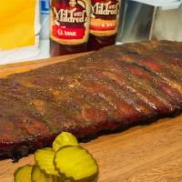 Full Slab And Your Choice Of 2 Large Sides  · 1 Slab of St. Louis cut Ribs and two 16 oz Sides. Choose your sauce. Sides: Baked beans, Col...
