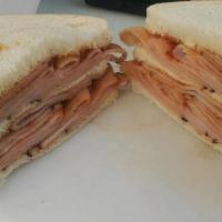 Turkey Sandwich (1/2 Lb) · 1/2 pound Turkey sandwich on bread with pickles.
Choose your sauce sweet and spicy or classi...