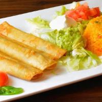 Taquitos · Three rolled tortillas stuffed with beef or chicken, served with lettuce, sour cream, guacam...