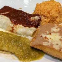 Enchiladas Banderas · One shredded beef enchilada with green sauce, one shredded chicken enchilada with melted che...