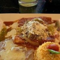 Enchiladas Rancheras · Three cheese enchiladas topped with red sauce and shredded beef. Served with rice and beans.