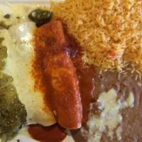 Enchiladas Tres Marias · Three enchiladas stuffed with steak or grilled chicken, one topped with green sauce, one wit...