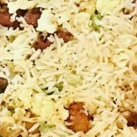 Chicken Fried Rice · Premium basmati rice stir fried to perfection in Indo-Chinese style with chicken.
