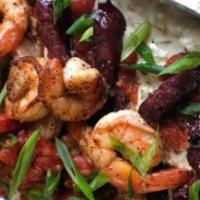 Cajun Shrimp Pasta · Cajun shrimp, bow tie pasta, Andouille sausage (Chicken Andouille sausage available on reque...