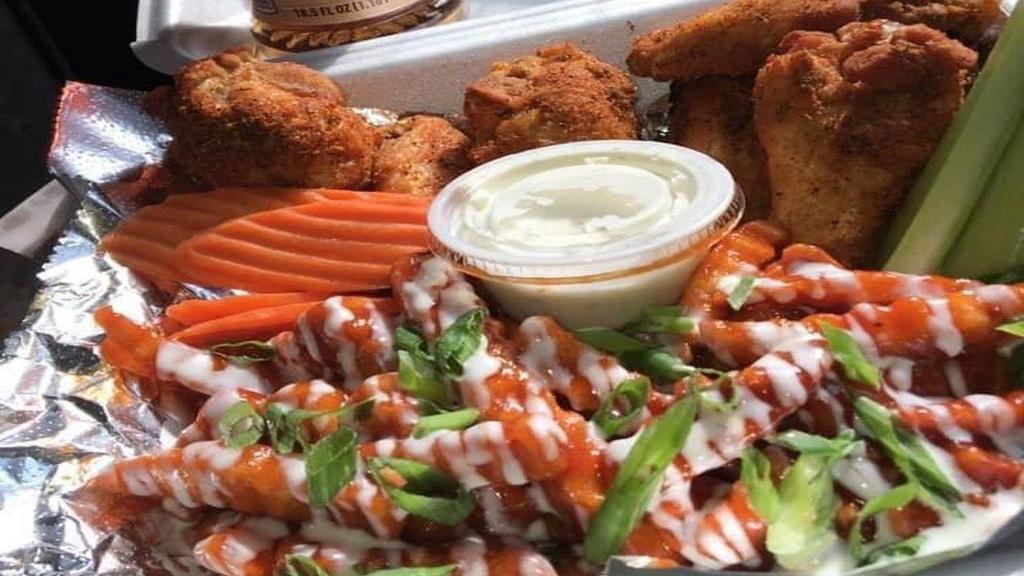 Pop'S Wings Basket  · Your choice of flavor: Cajun dry rub, Buffalo, BBQ, Garlic Parm or Sweet Heat.
served with crinkle fries, ketchup, celery, carrots and ranch.