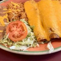 Numero 6 · Three beef enchiladas, served with rice and beans.