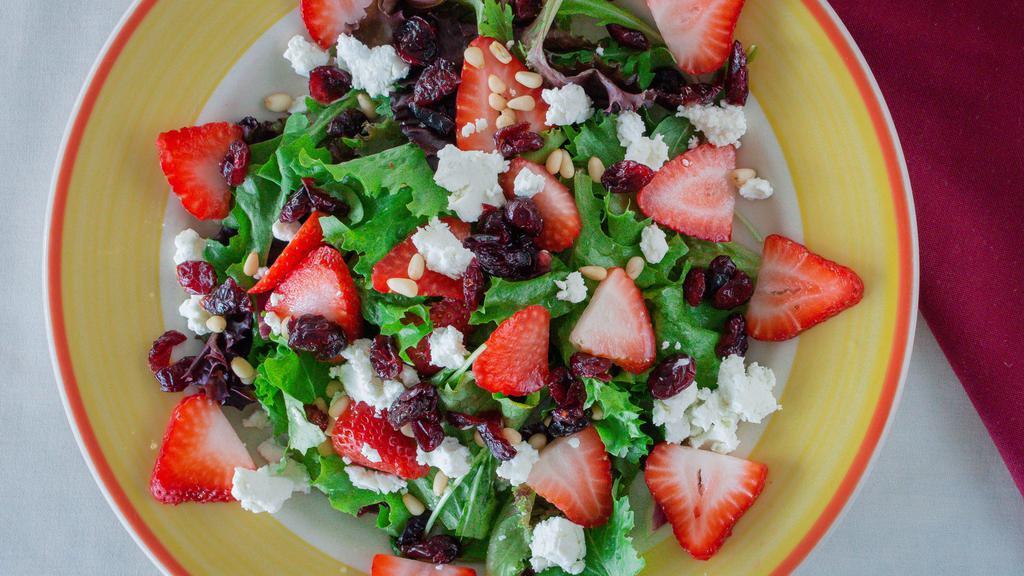 Ensalada De Fresa · Mixed greens and goat cheese salad with strawberries, dried cranberries and pine nuts with balsamic vinaigrette dressing on the side. Add grilled chicken for an additional cost.