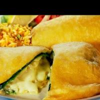 Chiles Rellenos De Queso · Vegetarian Favorite. Two green Poblano peppers stuffed with cheese, coated with egg batter a...