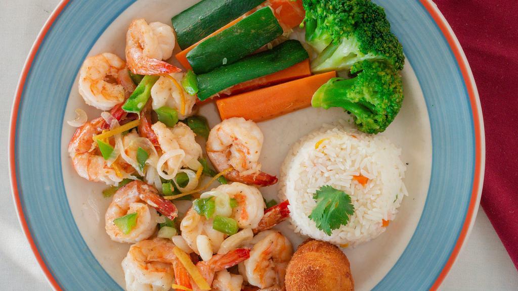 Camarones Con Naranja Y Tequila · Shrimp with orange and tequila. This delicious dish has an orange-and-jalapeño sauce for a tangy accent. Served with white rice, steamed vegetables and a pear-shaped potato.