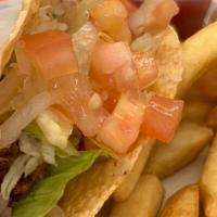 Kid'S Taco · Hard or soft shell with ground beef or chicken. Served with french fries or Spanish rice and...
