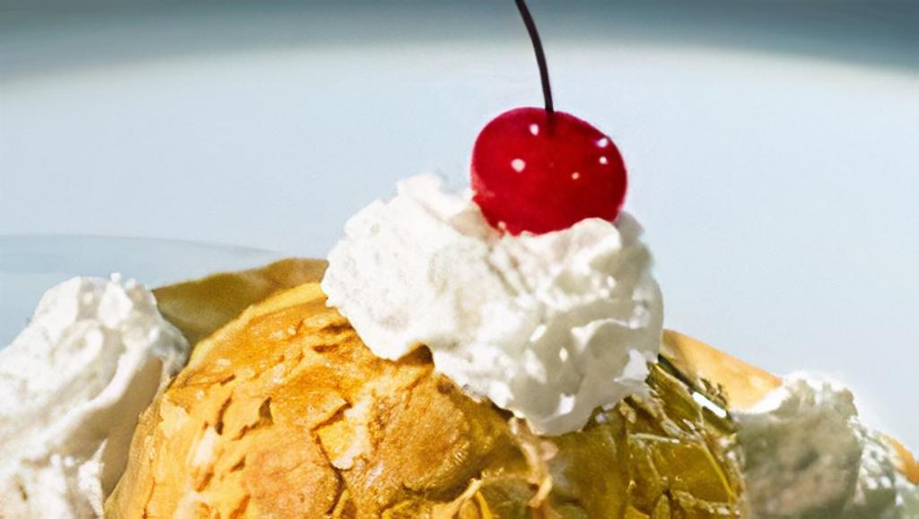 Fried Ice Cream · The perfect dessert for any meal. Vanilla ice cream served in its own edible cinnamon shell. Topped with honey and whipped cream.