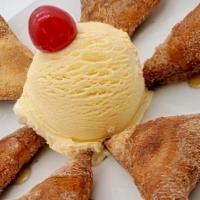 Sopapillas · Golden brown fritter, sprinkled with cinnamon sugar and honey. Served with vanilla ice cream...