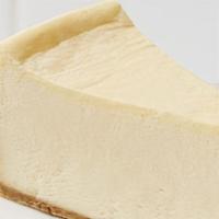 Cheesecake · Delicious creamy plain cheesecake with a graham cracker crust and sour cream mousse topping.