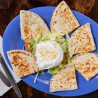 Quesadillas · served with lettuce, tomato, onion and sour cream.