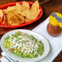 Chips And Salsa · Tortilla Chips freshly made at El Jardin with 8 ounce side of Salsa