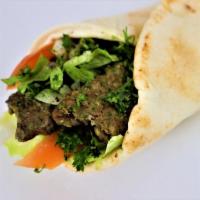 Kabab Wrap · A mix of ground beef and lamb grilled to perfection with onion and parsley salad, drizzled w...