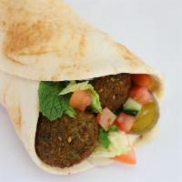 Falafel Wrap · Made from scratch vegan falafel balls with hummus, fresh house salad, pickles and drizzled w...