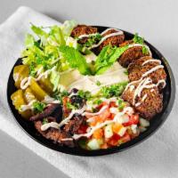 Falafel Deluxe Bowl · Basmati rice, topped with our made from scratch falafel balls, hummus, fried eggplant, fresh...