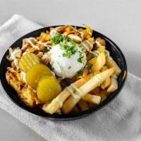 Shawarma Loaded Fries · French fries loaded with Thinly sliced chicken shawarma that has been slowly roasting on a s...