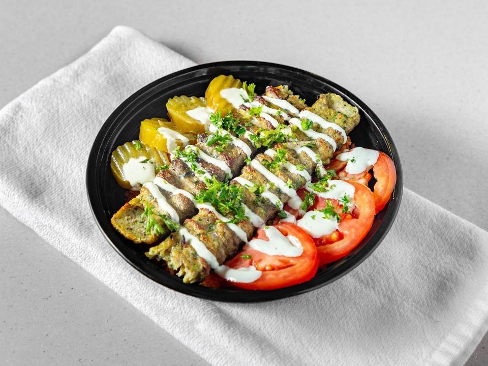 Chicken Kabab Bowl · Basmati rice topped with grilled to perfection ground chicken kebab, tomato, pickles, and drizzled with our signature cucumber sauce.