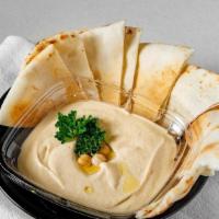 Hummus W/ Pita Bread · A famous creamy dip made from scratch using chickpeas, extra virgin olive oil, lemon juice, ...