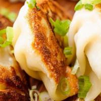 Pan Seared Pork Potsticker · Pork & cabbage, pan fried with sweet & soy sauce.