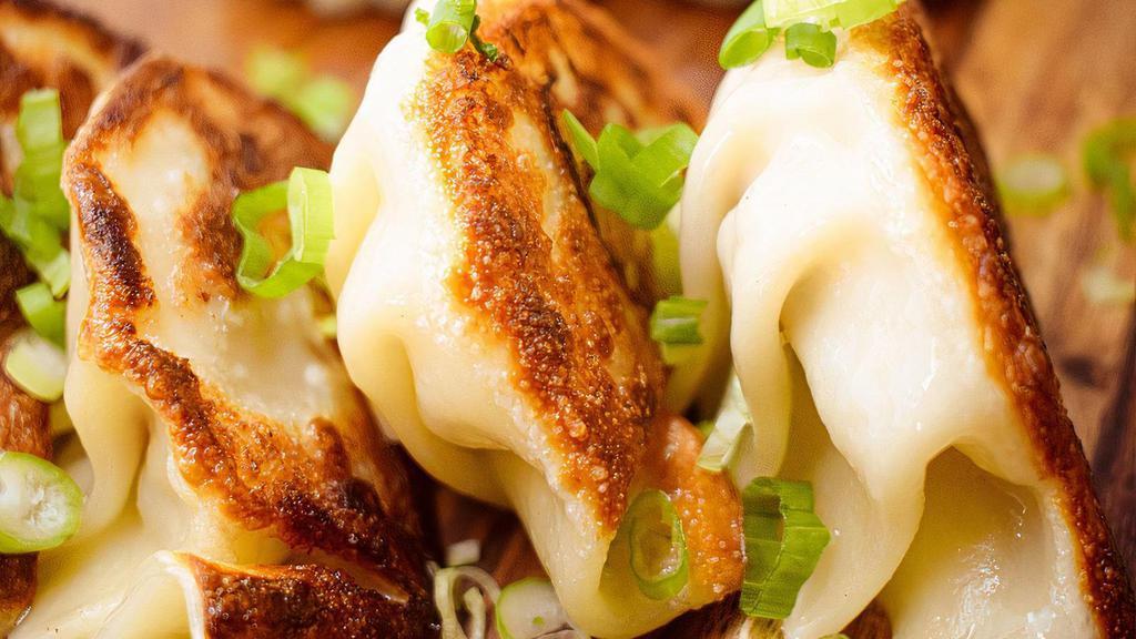Pan Seared Pork Potsticker · Pork & cabbage, pan fried with sweet & soy sauce.