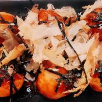 Takoyaki · Fried octopus balls topped with bonito flakes and shredded nori.
