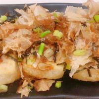 Agedashi Tofu · Crispy deep fried tofu topped with scallions, bonito flakes, and shredded nori in savory das...