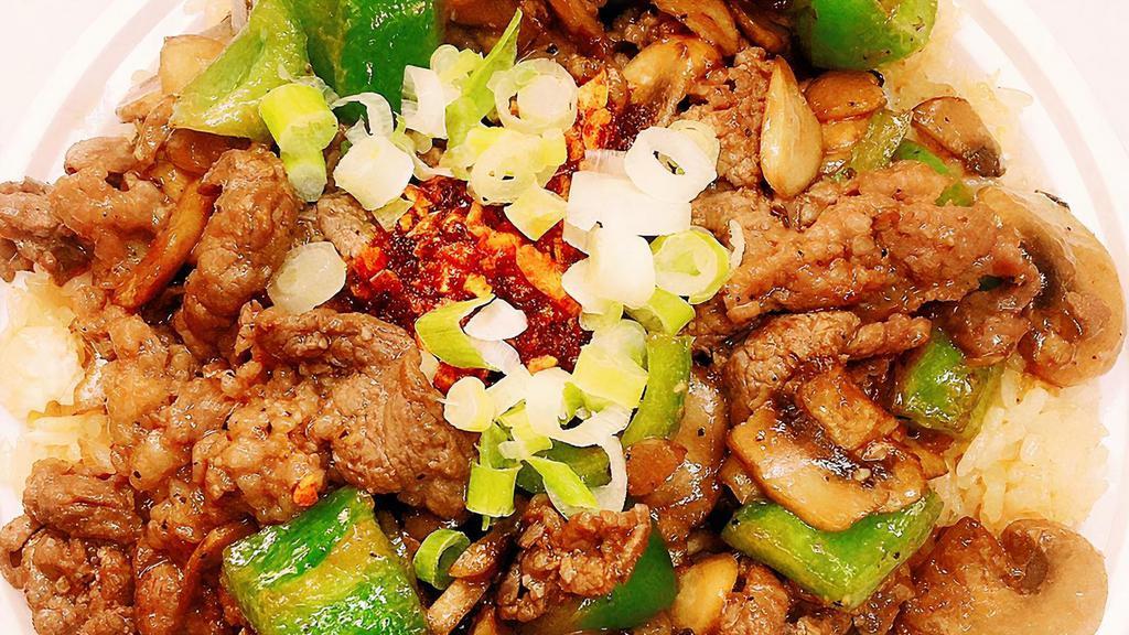 Beef Bibimbap · Rice with beef, scallions, bell pepper, scrambled eggs, mushroom, and garlic sauce.