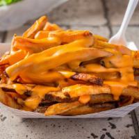 Cheese Fries · Topped with Merkt's cheddar.