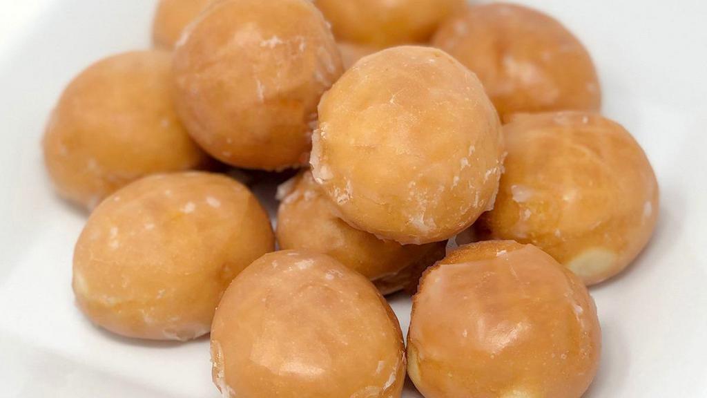 Dozen Donut Holes, Glazed · The center is the best part glazed donut holes packed by the dozen and there's no harm in licking your fingers afterwards.