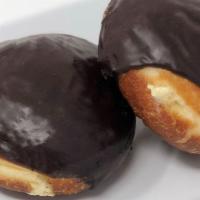 Filled Donut, Vanilla · A bavarian (vanilla) cream filled donut iced in chocolate. The heaven of all donuts!