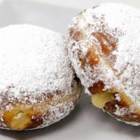 Filled Donut, Lemon · A Lemon filled donut covered in powered sugar. The tartness of the lemon paired with the swe...