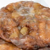 Apple Fritter · A thin crispy cinnamon dough with chunks of apples and a glaze icing. Fried to perfection an...