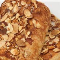Almond Croissant · A croissant pocket baked with an almond filling and topped with sliced almonds.